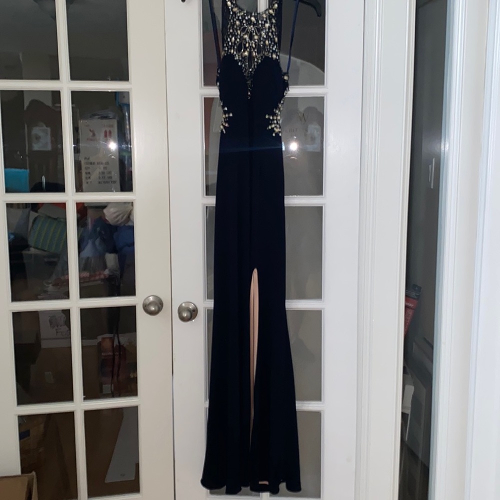 Navy blue high-neck, open back prom dress with slit